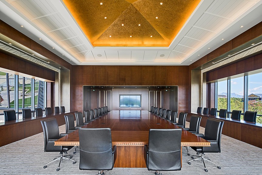 A conference room with a large table.